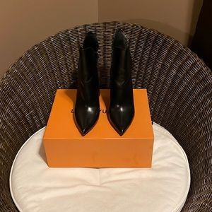 Authentic Louis Vuitton Pokerface Python Boots. Previously worn.